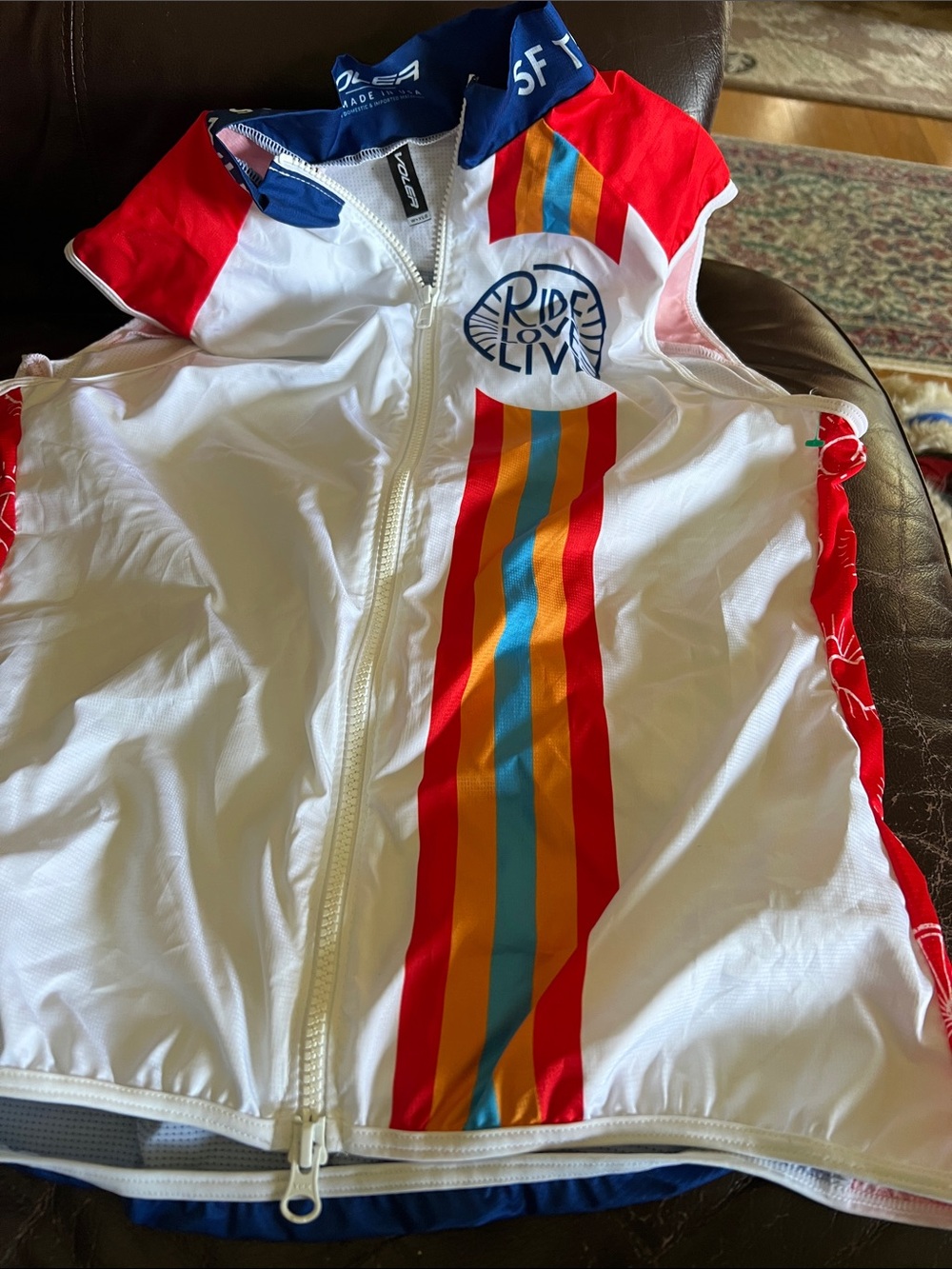 Ride & Live Women's White Cycling Vest with Red & Blue Stripe Detail